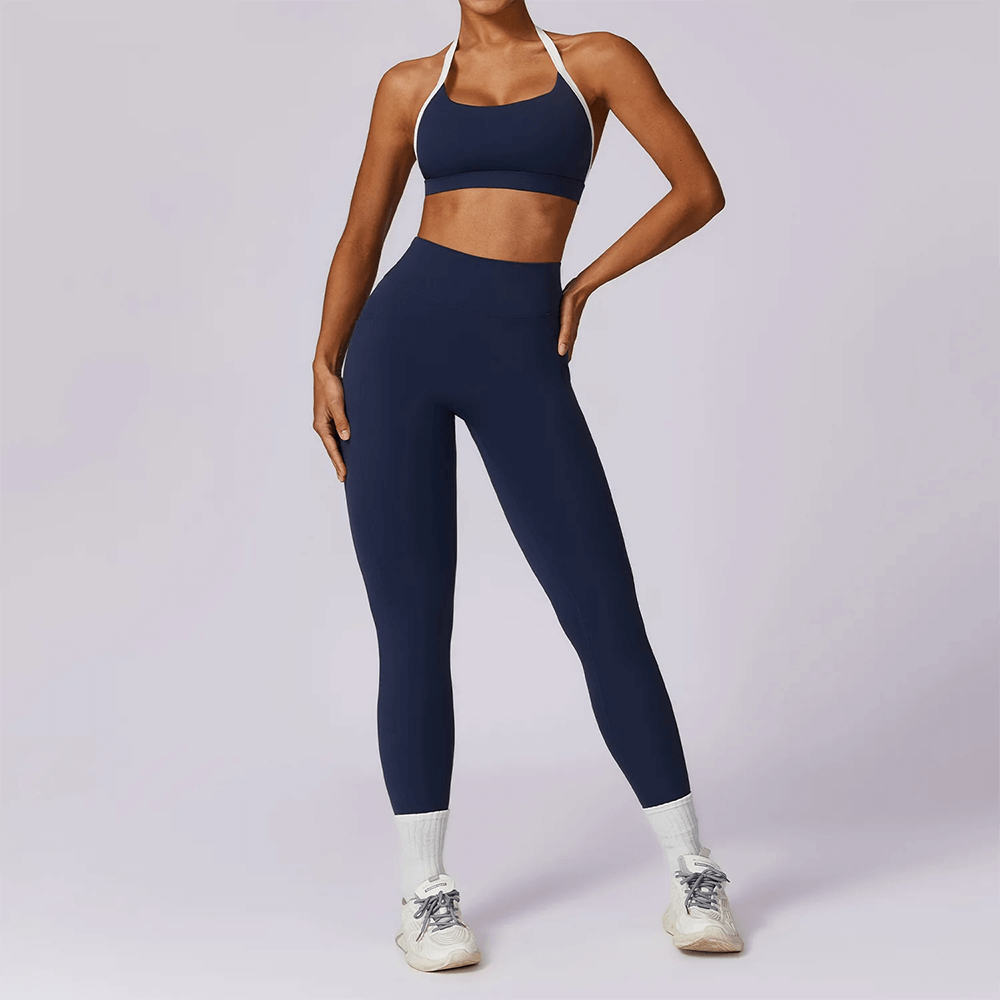 Women's navy yoga set with sleeveless top and leggings, perfect for fitness and yoga. Durable and flexible workout gear SF2374.